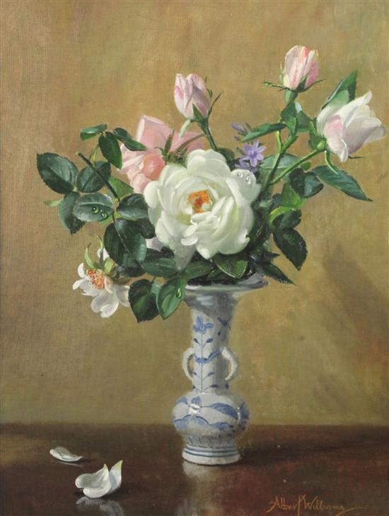 Albert Williams (1922-2010) Still life of roses in a delft vase 17.5 x 13.5in.